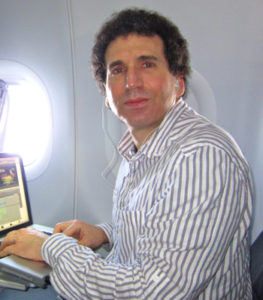 Tony Bennis editing while flying in plane